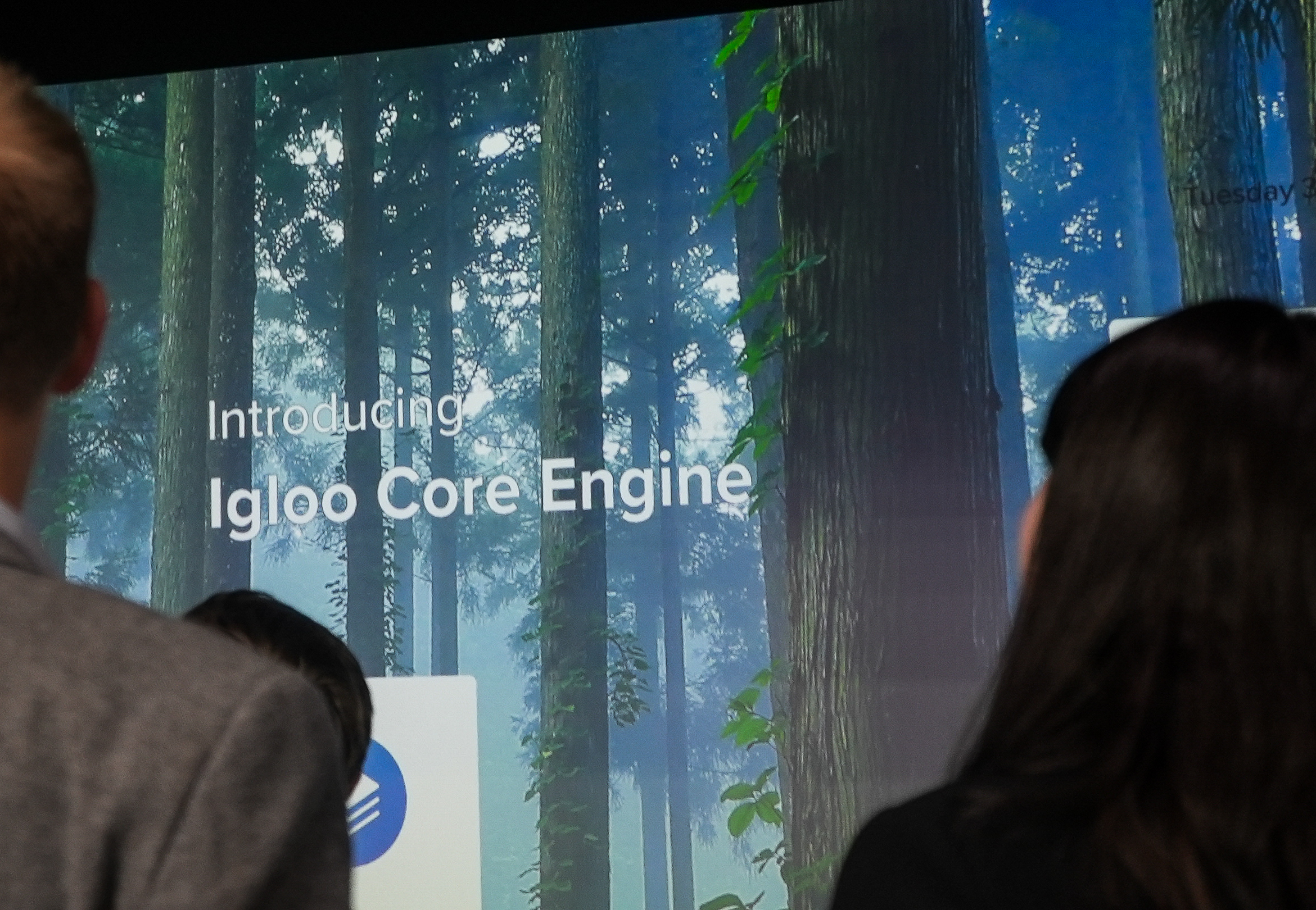 people looking at a screen introducing igloo core engine