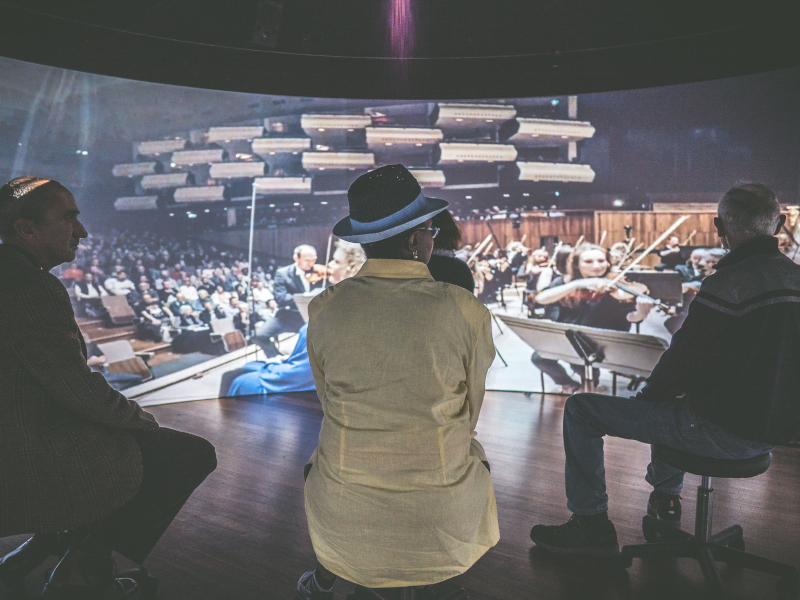 Three people in the immersive orchestra experience