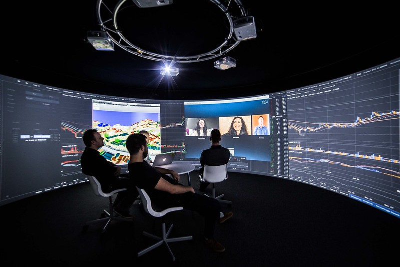 Four men sat in an Igloo installed immersive meeting room