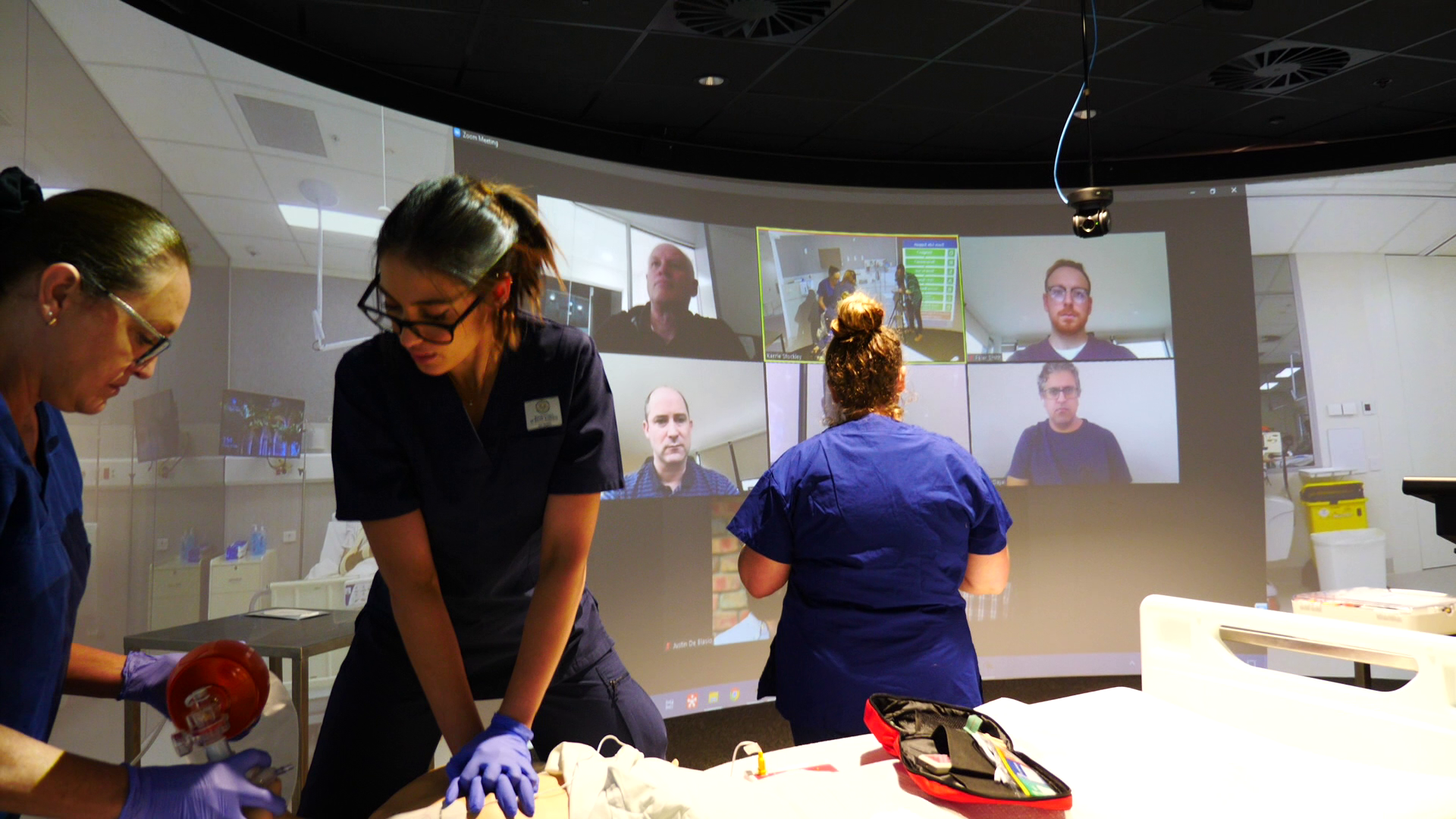 Medical students in scrubs using Igloo for teams meetings & education