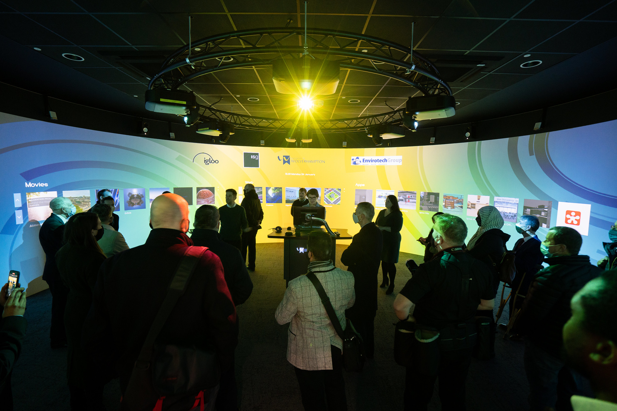 A crowd of people inside an igloo immersive space enjoying the experience