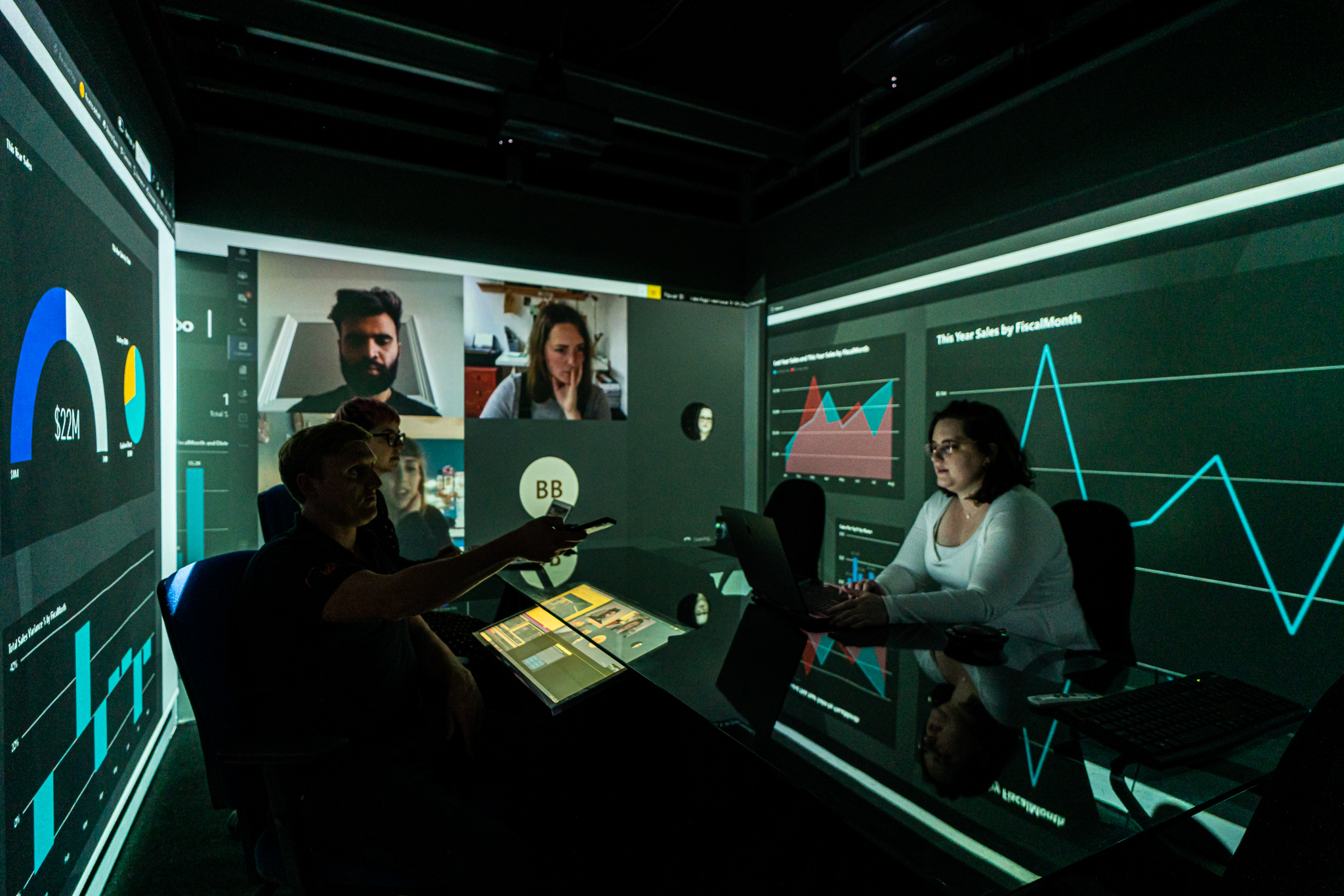 Three people inside an Igloo immersive workspace.