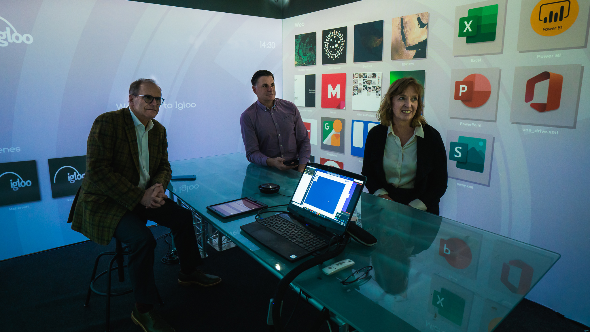 Three people in meeting room using Igloo Immersive Media Player