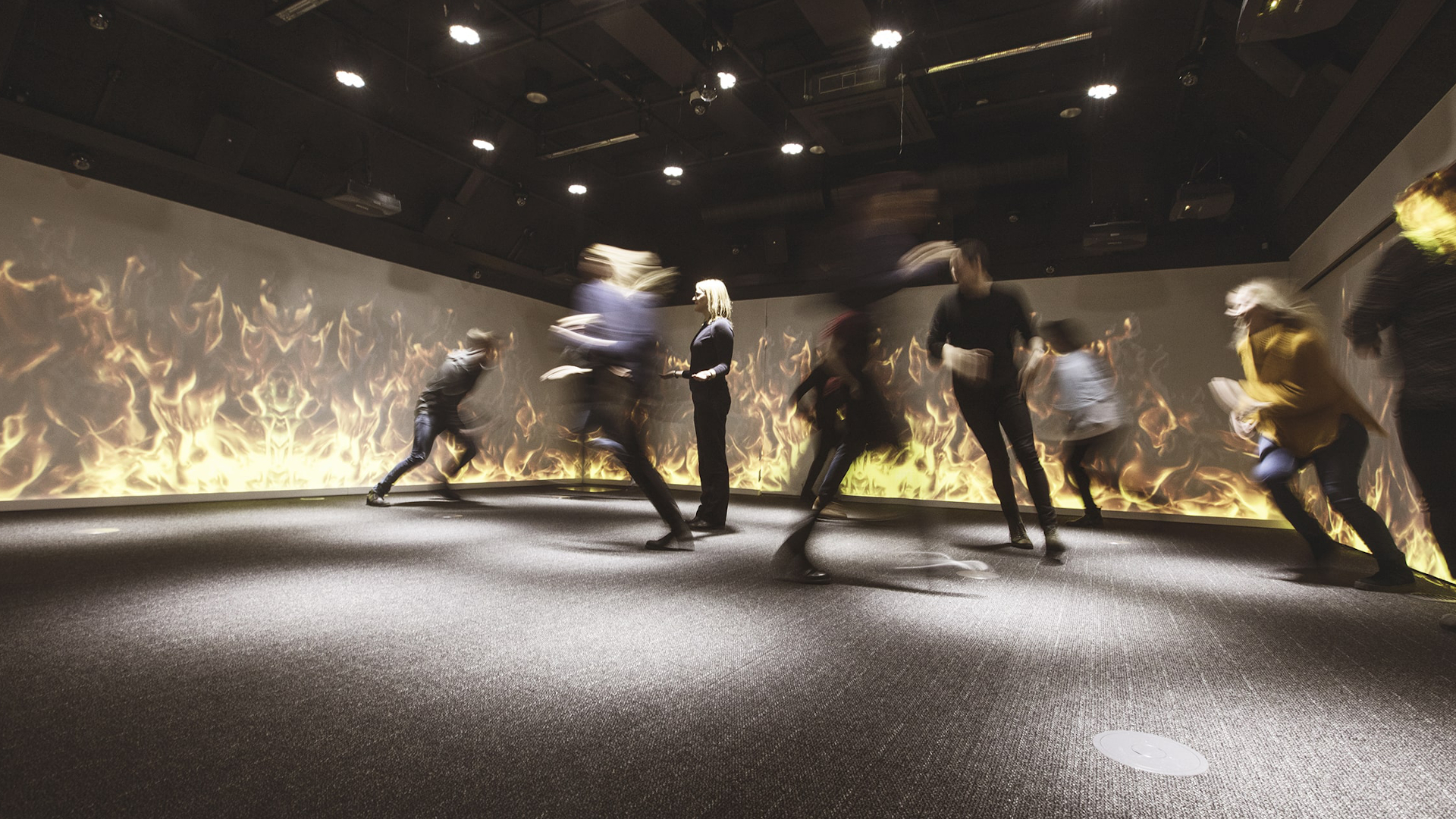 multiple people moving around an igloo cube