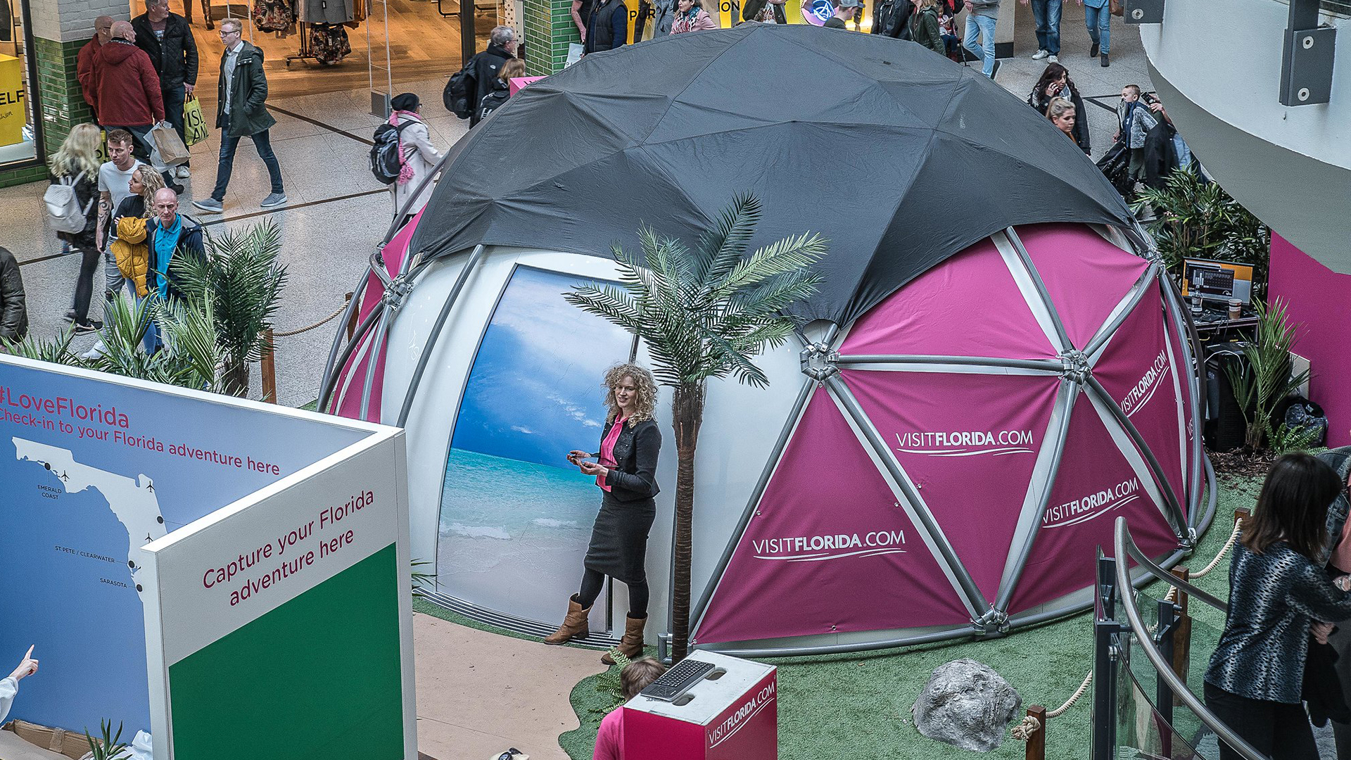 woman standing outside an immersive dome