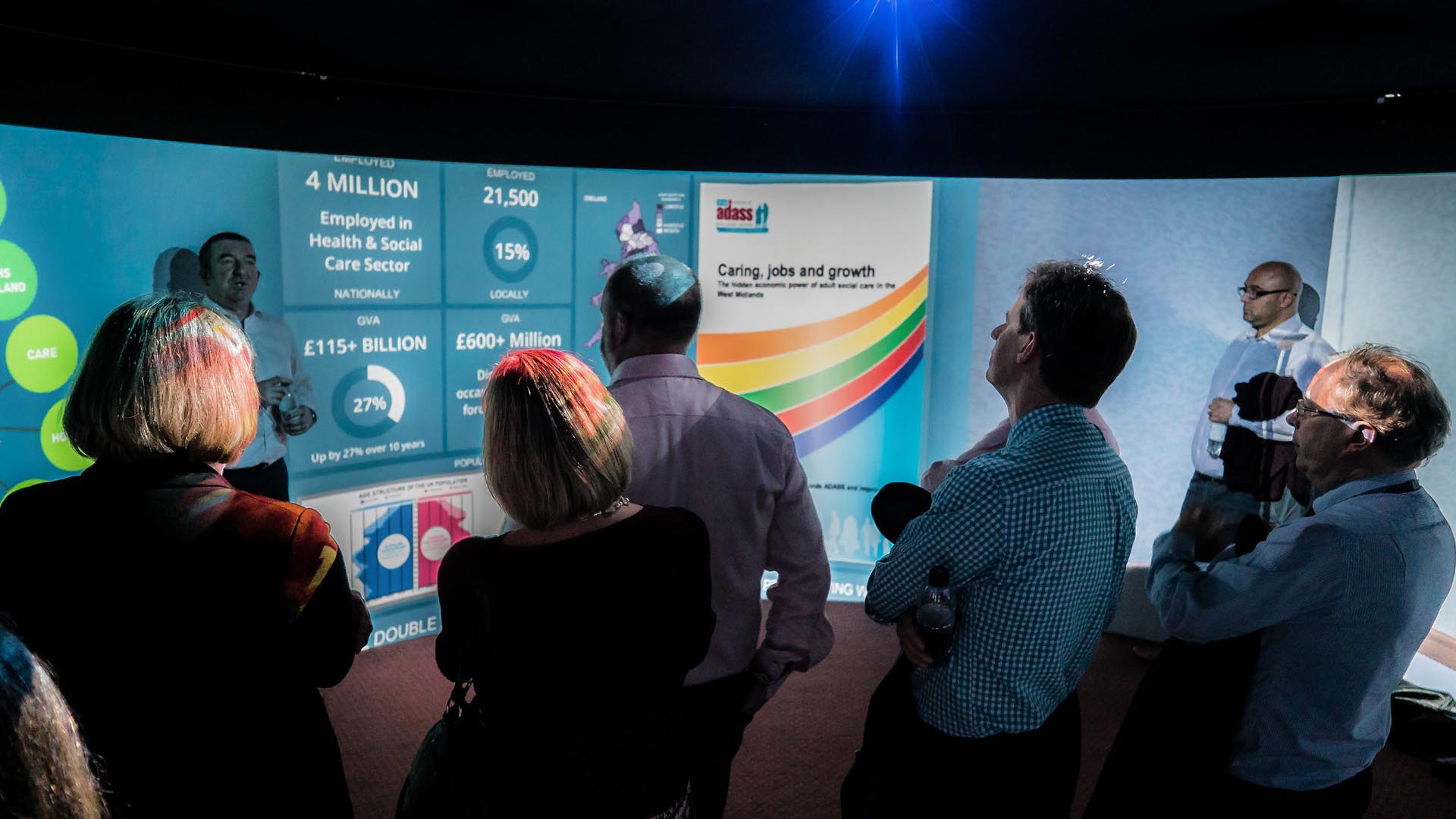 people spectating a meeting in an igloo room